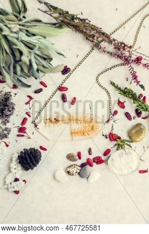 Close Up Pendant With Dry Fern Branch And Floral Details Concept Photo. Top View Photography With Li