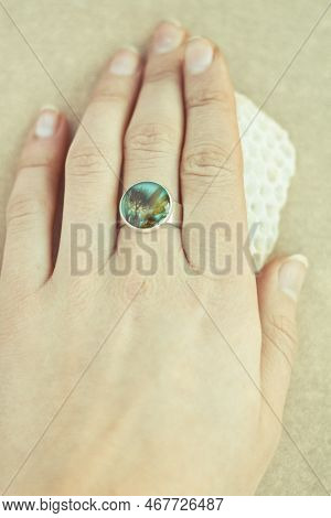 Close Up Female Hand With Craft Ring Holding Honeycomb Concept Photo. First View Person Photography 
