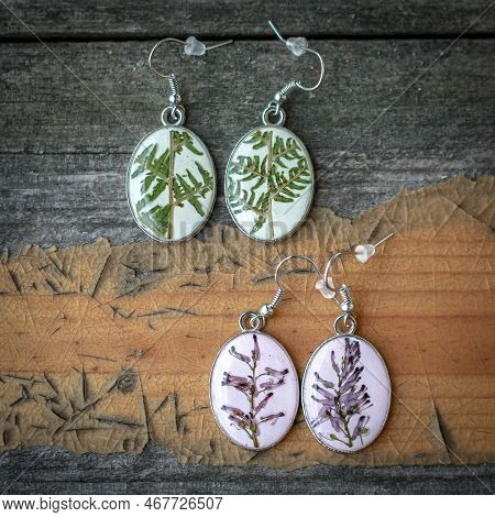Close Up Craft Earrings With Lavender And Fern Concept Photo. Top View Photography With Wooden Table