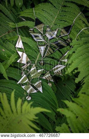 Close Up Necklaces With Natural Details Concept Photo. Handmade Jewelry. Front View Photography With
