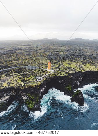 Vertical Photo Of Svortuloft Lighthouse On The Volcanic Coast Of Iceland