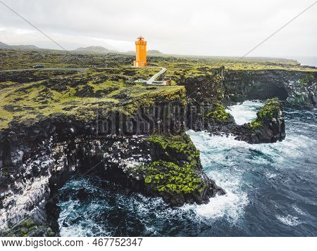 Svortuloft Lighthouse In West Iceland Highlands With Stormy Sea Down Bellow