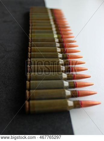 Vertical Photo Of Unitary Cartridges For Assault Rifle In Line On Black And White Background With So