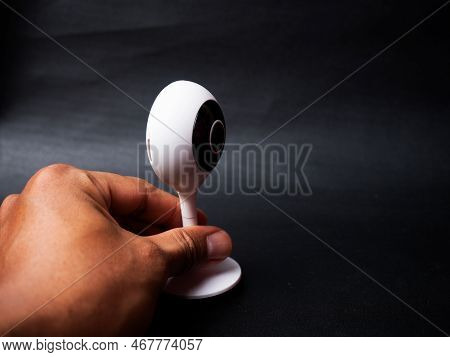 Picture Of A White Table Top Ip Cctv Camera With Modern Design On A Black Background