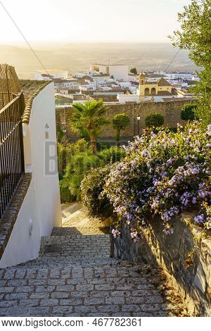 Narrow Alley Leading To The White Houses Of The Picturesque Village Of Medina Sidonia, Cadiz.
