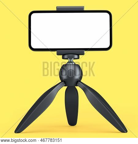 Realistic Smartphone With Blank White Screen On Black Tripod Isolated On Yellow Background. 3d Rende
