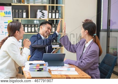 Team Business Three Smiling And Happy Asian Men And Women Team Using Tablets And Laptops Brainstorm 