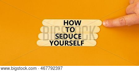 How To Seduce Yourself Symbol. Concept Word How To Seduce Yourself On Wooden Sticks. Businessman Han