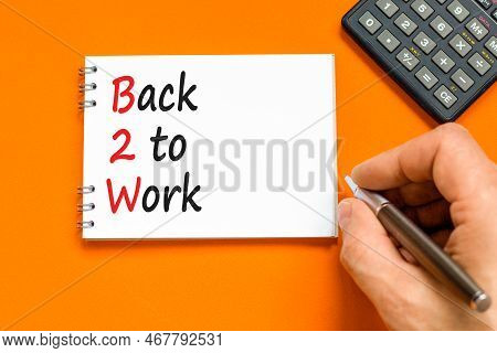 B2w Back To Work Symbol. Concept Words B2w Back To Work On White Note On A Beautiful Orange Table Or