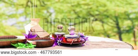 Natural Essential Oils, Plants And Aromatic Incense On A Wooden Table With Defocused Natural Backgro