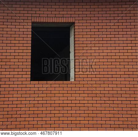 Fragment Of A Red Brick Wall With An Empty Window