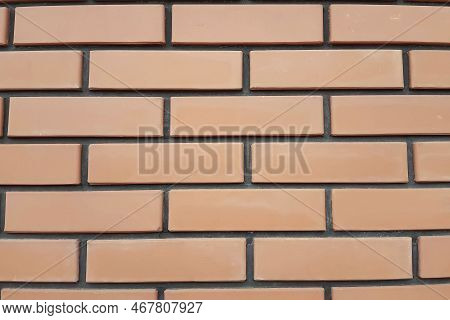 Fragment Of A Wall With A Red Facing Brick