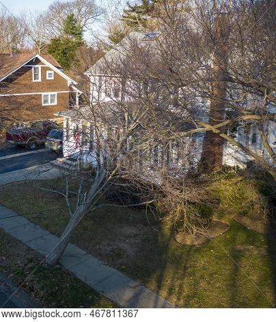 Tree Lying On A Houe After Falling During A Wind Storm On Christmas Eve Taken From Above By A Drone.