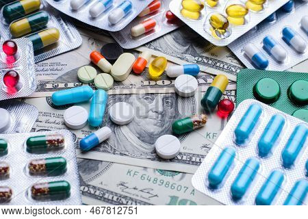 Medicine Pills Or Capsules Money Banknotes. Medical Or Pharmacy Prescription For Health. Concept Of 