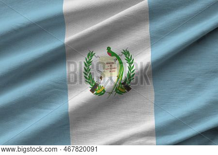 Guatemala Flag With Big Folds Waving Close Up Under The Studio Light Indoors. The Official Symbols A