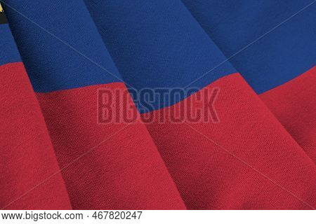Liechtenstein Flag With Big Folds Waving Close Up Under The Studio Light Indoors. The Official Symbo