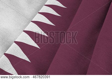 Qatar Flag With Big Folds Waving Close Up Under The Studio Light Indoors. The Official Symbols And C