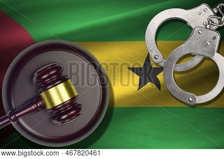 Sao Tome And Principe Flag With Judge Mallet And Handcuffs In Dark Room. Concept Of Criminal And Pun
