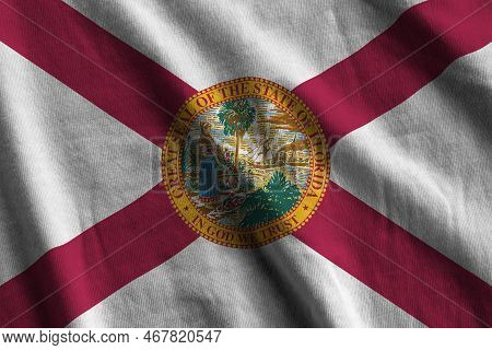 Florida Us State Flag With Big Folds Waving Close Up Under The Studio Light Indoors. The Official Sy