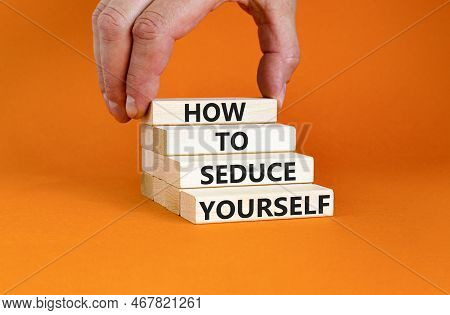 How To Seduce Yourself Symbol. Concept Word How To Seduce Yourself On Wooden Blocks. Businessman Han