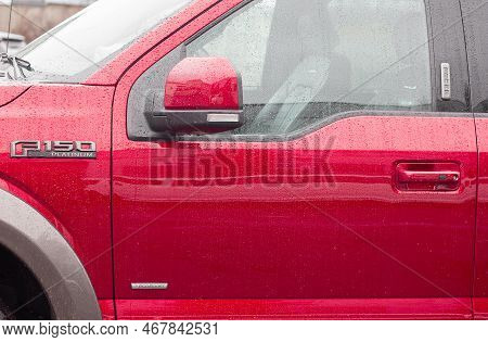 Lviv, Ukraine - 12 24 2022: Red Display Of Ford F-150 In A Car Dealership. Ford F150 Available In Pl