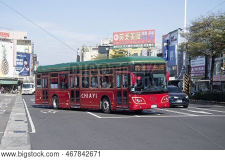 Chiayi, Taiwan- 5 Dec, 2022: Public Bus Travels On The Street Of Chiayi City. Chiayi Is A Major City