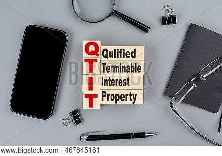 Wooden Cubes Qtip Qualified Terminable Interest Property Wtih Notebook , Magnifier And Smartphone, B