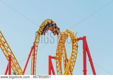 Roller Coaster Up Down Turn And A Passing Loop Feint, Spiral Train Of Trolleys Tends To Go Down