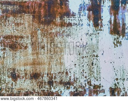 Close Up To Colored Peeling Paint Texture On Rusty Metal Surface. The Old Steel Wall, Painted And Pu