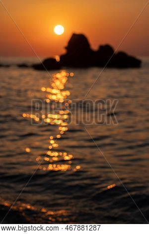 Blurry Orange And Golden Skylight Calmness Relaxing Summer Mood. Sunset Sky Reflecting In The Water.