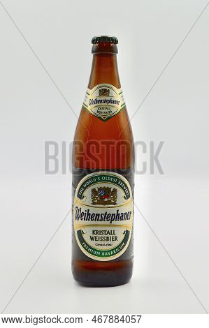 A Closeup Of A Bottle Of Weihenstephaner Kristall Weissbier Against A White Background. Blue Mountai