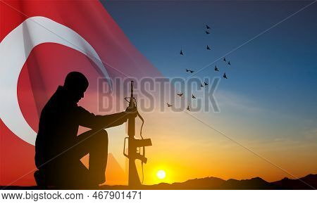 Silhouette Of Soldier Kneeling Down On The Sunset And Turkey Flag. Greeting Card For Turkish Armed F
