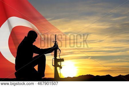 Silhouette Of Soldier Kneeling Down On The Sunset And Turkey Flag. Greeting Card For Turkish Armed F