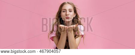 Portrait Of Sensual And Tender Gentle Young Wman With Wavy Natural Hair Bending Towards Camera Facin