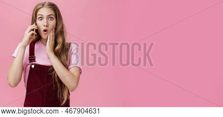 Waist-up Shot Of Shocked Woman Learning Stunning News Via Smartphone Talking On Phone Holding Cellph