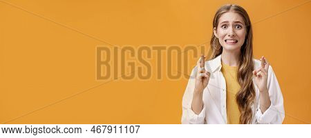 Girl Hopes She Did Well On Exam Clenching Teeth Looking Worried And Concerned, Crossing Fingers For 