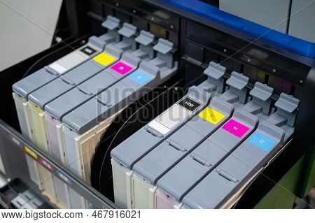 Row Of Inkjet Printer Cmyk Cartridges - Cyan, Magenta, Yellow, Key Or Black Colors - Close Up View.