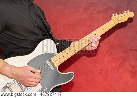 Vaduz, Liechtenstein, December 23, 2022 Musician Plays With A White Fender Telecaster Electric Guita