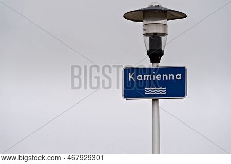 Blue Plate With The Name Of The River, Suspended On The Lighting Lantern. A Plaque Announcing The 
