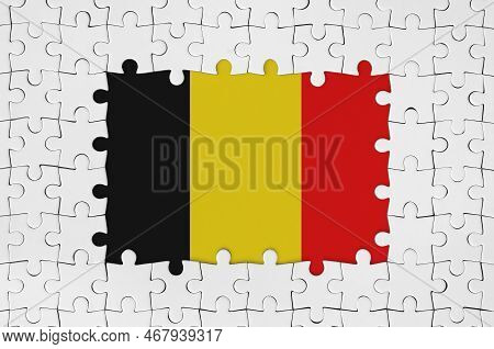 Belgium Flag In Frame Of White Puzzle Pieces With Missing Central Parts