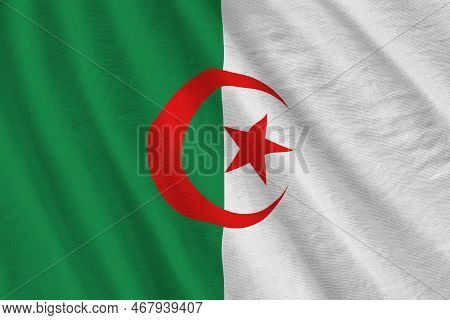 Algeria Flag With Big Folds Waving Close Up Under The Studio Light Indoors. The Official Symbols And