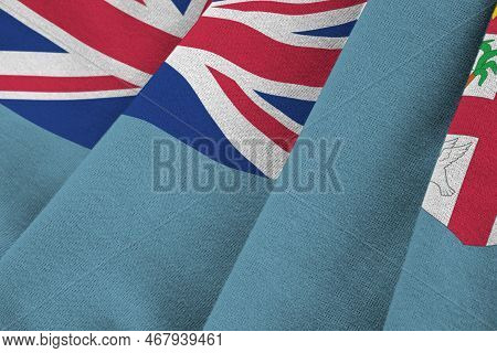 Fiji Flag With Big Folds Waving Close Up Under The Studio Light Indoors. The Official Symbols And Co