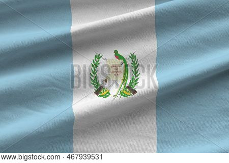 Guatemala Flag With Big Folds Waving Close Up Under The Studio Light Indoors. The Official Symbols A