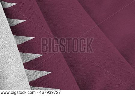 Qatar Flag With Big Folds Waving Close Up Under The Studio Light Indoors. The Official Symbols And C