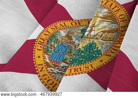 Florida Us State Flag With Big Folds Waving Close Up Under The Studio Light Indoors. The Official Sy