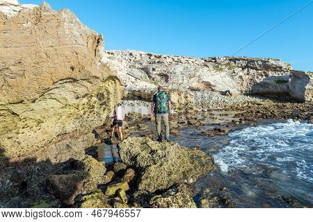 Arniston, South Africa - Sep 22, 2022: People Walking Back To The Parking Area From The Waenhuiskran
