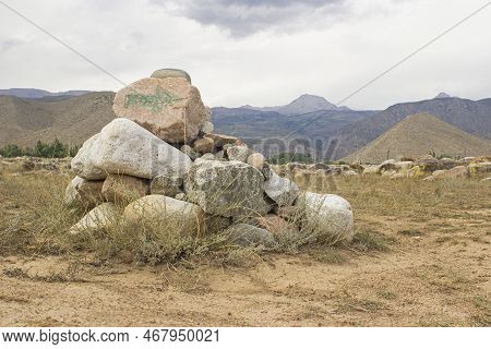Petroglyphs On The Rocks In Kazakhstan. The Ancient Parking Cave Man. Historical Cave Paintings. Car