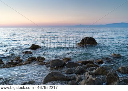 Beautiful View Of Orange Sunset Seascape With Rocks In Italy. Tropical Colourful Sunrise Landscape. 