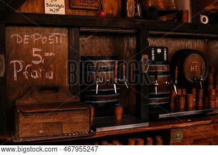 Dresden, Saxony, Germany, 10 December 2022: Clay Cups And Barrels For Christmas Mulled Wine On Woode