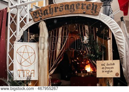 Dresden, Saxony, Germany, 10 December 2022: Christmas Medieval Outdoor Market Stall Decorations With